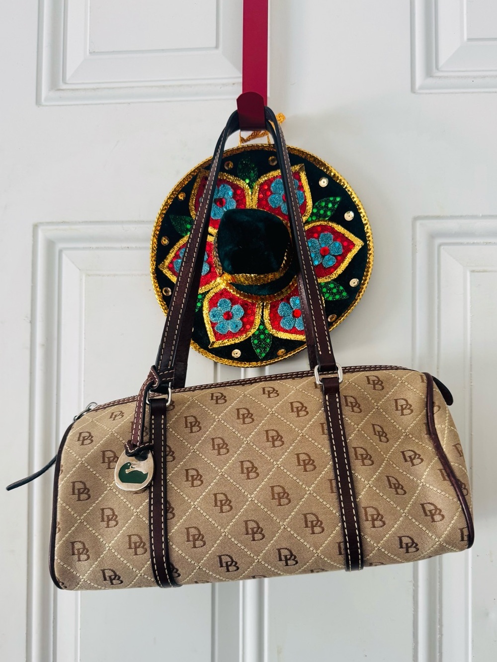 Dooney & Bourke Beige Logo Quilted Barrel Shoulder Bag with Brown Trim